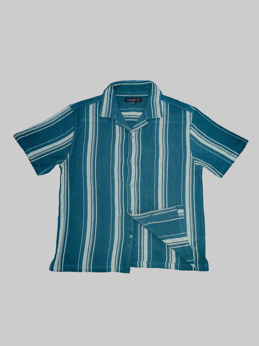 Blue and white striped shirt on a textured surface