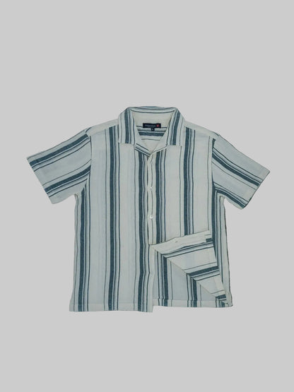 Striped shirt on a textured black surface