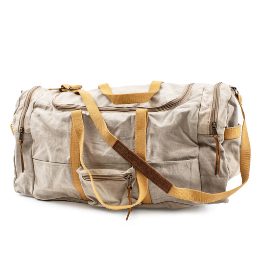 Beige duffel bag with yellow straps on a white background