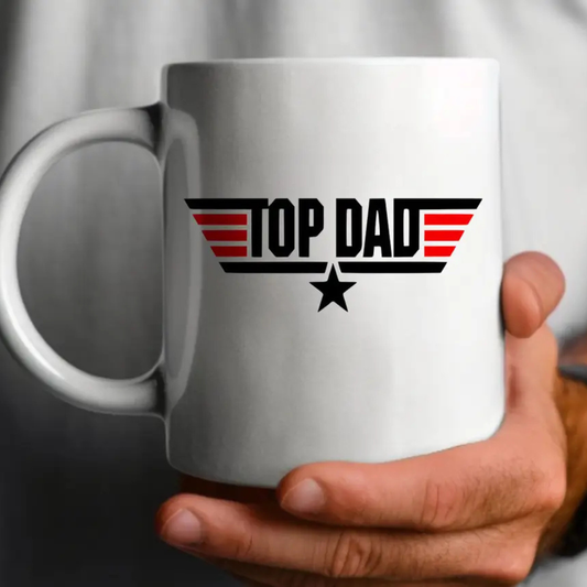 White mug with 'Top Dad' design held by a person